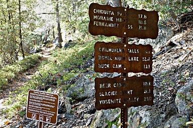 Signs above the lower falls when the stock trail and hiking trail reconnect.