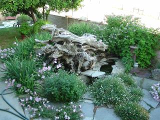 Fountain made of 3 oak piled oak stumps